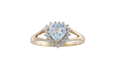 Lot 21 - A DIAMOND AND BLUE TOPAZ CLUSTER RING, mounted...