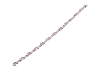 Lot 75 - A DIAMOND AND PINK SAPPHIRE BRACELET, bow...