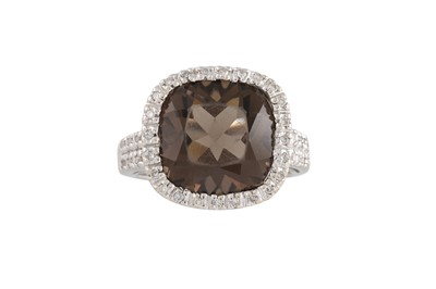 Lot 81 - A SMOKY QUARTZ AND DIAMOND CLUSTER RING, to...