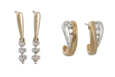 Lot 165 - A PAIR OF DIAMOND EARRINGS, channel set in two...