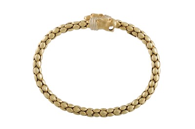 Lot 369 - AN 18CT GOLD BANGLE, flexible design, the ends...