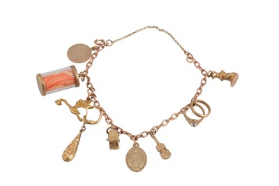 Lot 351 - A 9CT GOLD CHARM BRACELET, suspending various...