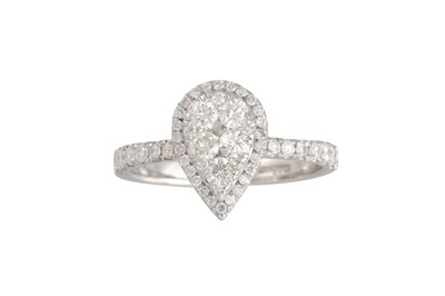 Lot 130 - A DIAMOND CLUSTER RING, the pear shaped panel...