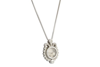 Lot 134 - A DIAMOND SET PENDANT, comprising a glass case...