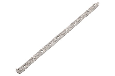 Lot 391 - A DIAMOND SET PLAQUE PANEL BRACELET, set with...