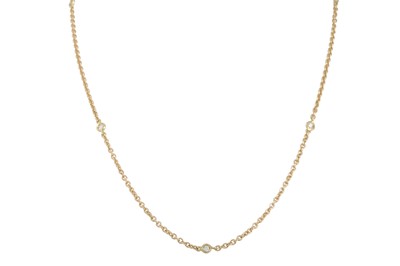 Lot 294 - A DIAMOND NECKLACE, the collet set brilliant...