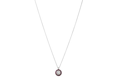 Lot 320 - A RUBY AND DIAMOND CLUSTER PENDANT, pavé set...