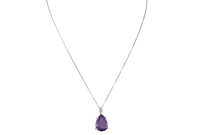 Lot 323 - AN AMETHYST AND DIAMOND PENDANT, the large...
