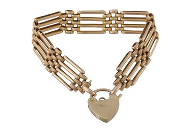 Lot 258 - AN ANTIQUE 15CT GATE BRACELET, with 9ct gold...