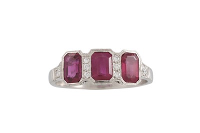 Lot 271 - A THREE STONE RUBY RING, the rubies collet set,...