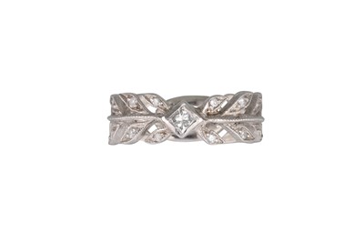 Lot 182 - A DIAMOND BAND RING, in platinum stamped 900....