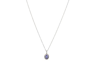 Lot 17 - A TANZANITE AND DIAMOND CLUSTER PENDANT, in...