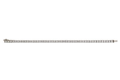 Lot 364 - A DIAMOND LINE BRACELET, the brilliant cut...