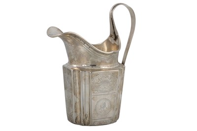 Lot 479 - A GEORGE III IRISH PROVINCIAL SILVER MILK JUG,...