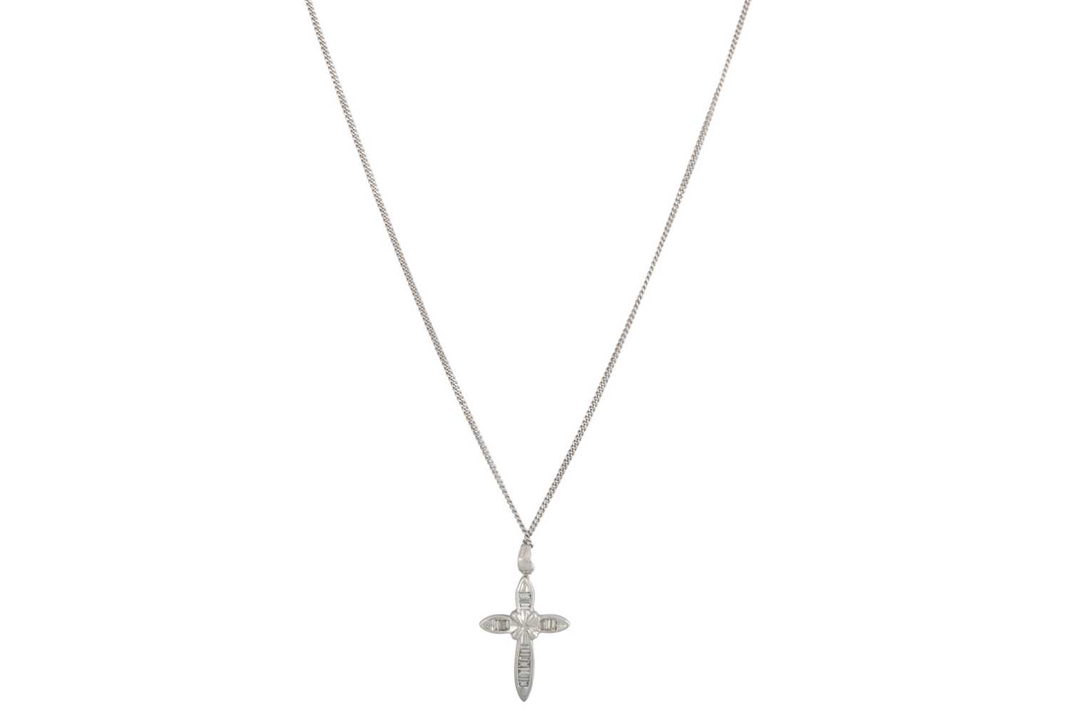 Lot 48 - A DIAMOND SET CROSS, channel set with baguette...