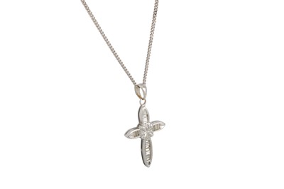 Lot 48 - A DIAMOND SET CROSS, channel set with baguette...