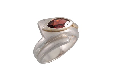 Lot 26 - A GARNET AND SILVER DRESS RING, the marquise...
