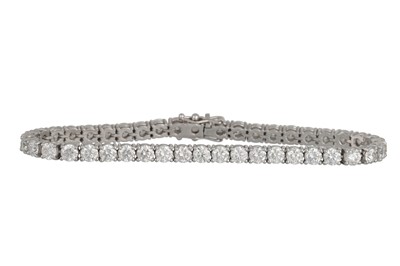 Lot 194 - A DIAMOND LINE BRACELET, the brilliant cut...