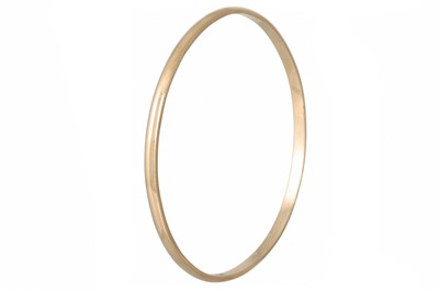 Lot 180 - A 9CT YELLOW GOLD FIXED BANGLE, 11.7 g.
