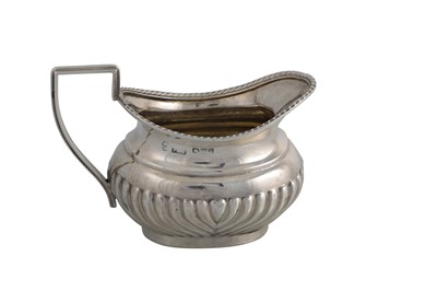 Lot 592 - A VICTORIAN SILVER GADROONED CREAM JUG,...