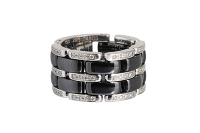 Lot 73 - A CHANEL 'ULTRA' BLACK CERAMIC RING, mounted...