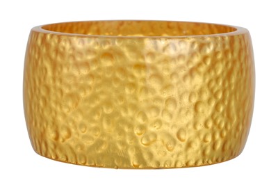 Lot 55 - A RESIN BRACELET, with 24ct gold leaf...