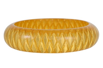 Lot 56 - A RESIN BRACELET, with 24ct gold leaf...