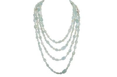 Lot 60 - A LONG AQUAMARINE BEADED NECKLACE, to a 18ct...