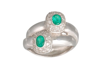 Lot 269 - AN EMERALD AND DIAMOND DOUBLE CLUSTER RING, of...