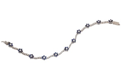 Lot 273 - A SAPPHIRE AND DIAMOND CLUSTER LINE BRACELET,...