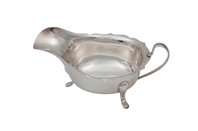Lot 455 - A MODERN SILVER HELMET SHAPED SAUCE BOAT, By...