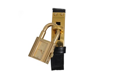 Lot 135 - AN HERMÈS GOLD PLATED 'KELLY' WRIST WATCH,...