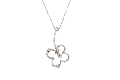 Lot 31 - A DIAMOND SET PENDANT, modelled as a stylised...