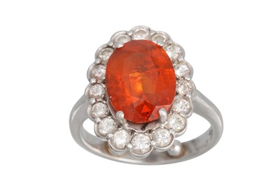 Lot 309 - A SPESSARTINE GARNET AND DIAMOND CLUSTER RING,...