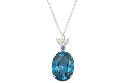 Lot 310 - A LARGE BLUE TOPAZ, the oval stone mounted in...