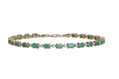 Lot 40 - AN EMERALD AND DIAMOND LINE BRACELET, mounted...