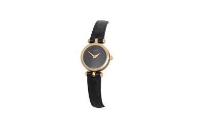 Lot 413 - A LADY'S GUCCI WRIST WATCH, black face & black...