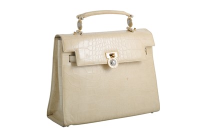 Lot 437 - A VERSACE CREAM LEATHER HANDBAG, the exotic...