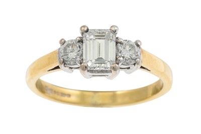Lot 148 - A THREE STONE DIAMOND RING, the emerald cut...