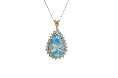 Lot 20 - A BLUE TOPAZ AND DIAMOND PENDANT, the pear...