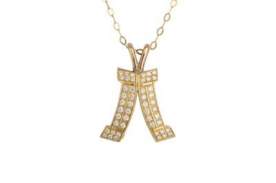 Lot 63 - A DIAMOND SET PENDANT, the shaped panel...