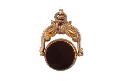 Lot 65 - AN ANTIQUE GOLD SWIVEL FOB, set with...