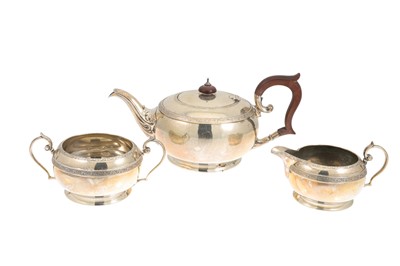 Lot 539 - A GEORGE V SILVER THREE PIECE TEA SET, of...