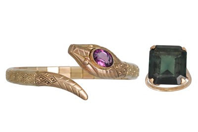 Lot 218 - A ROLLED GOLD BANGLE, in the form of a serpent,...