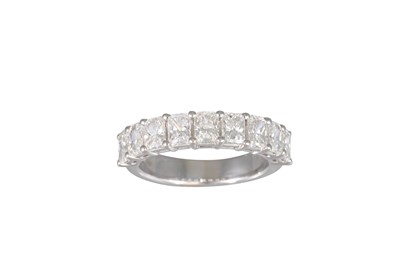Lot 165 - A RADIANT CUT DIAMOND HALF ETERNITY RING,...