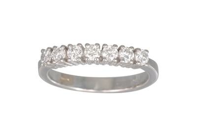 Lot 170 - A DIAMOND SEVEN STONE RING, the brilliant cut...