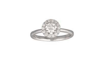 Lot 177 - A DIAMOND HALO CLUSTER RING, the brilliant cut...