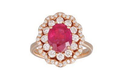 Lot 228 - A DIAMOND AND RUBY CLUSTER RING, the oval ruby...