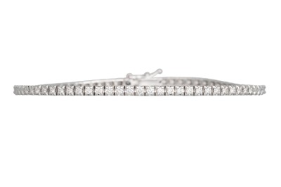 Lot 238 - A DIAMOND LINE BRACELET, the brilliant cut...