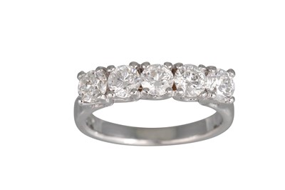 Lot 242 - A FIVE STONE DIAMOND RING, the brilliant cut...
